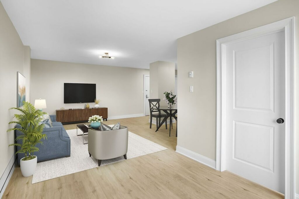 Spacious living room with hardwood style flooring at Bella Vista Apartments in NJ